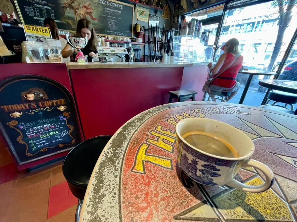 A coffee cup on a table inside a Calgary café