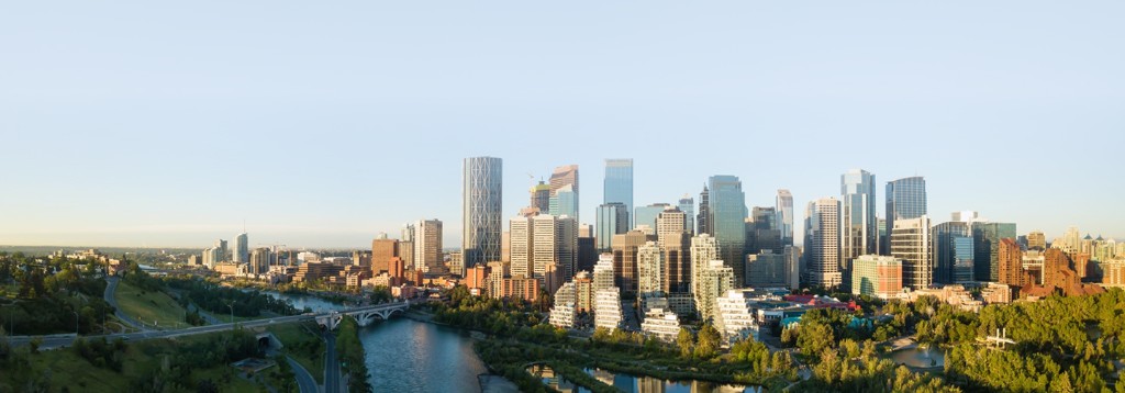 Panoramic view of the Calgary skyline and Bow River at golden hour
